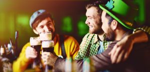 Three friends enjoying St. Patrick's Day at a bar